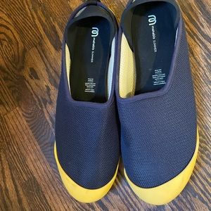 Mahabis slip on in navy with yellow base.